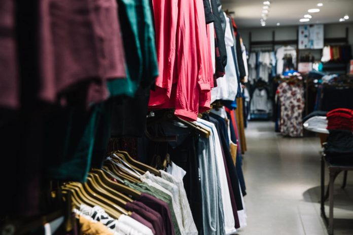 rows hangers with clothes