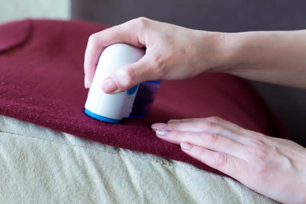 apparatus removing pellets from clothes hands woman close up 131087 1674