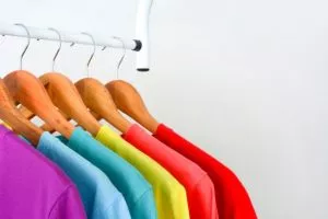 colorful rainbow t shirts hanging wooden clothes hanger white background 43448 79